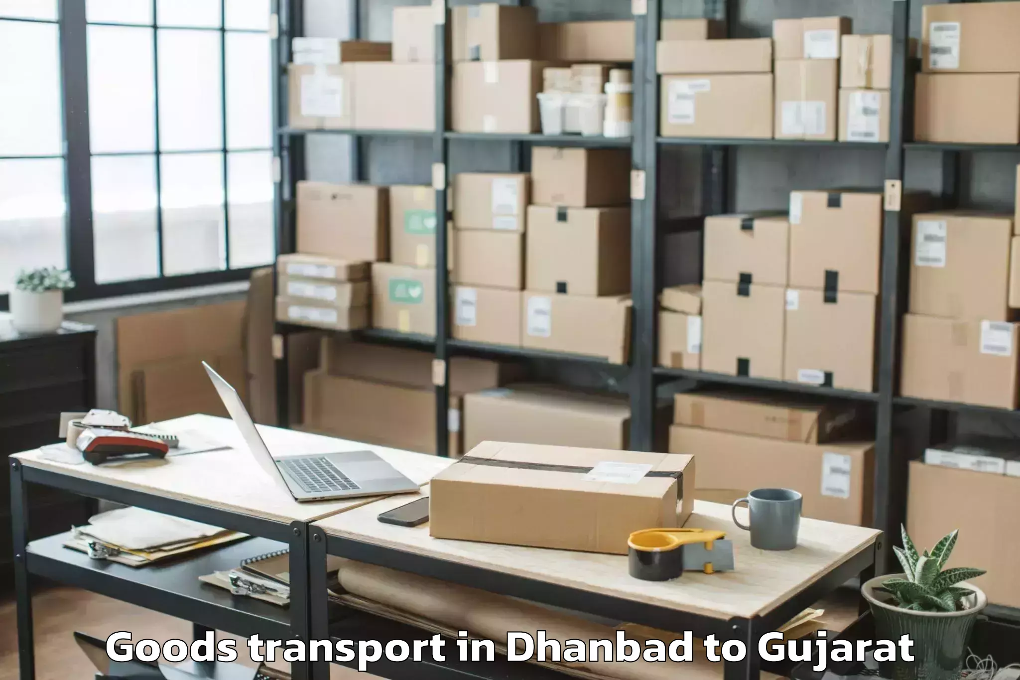 Trusted Dhanbad to Veer Narmad South Gujarat Univ Goods Transport